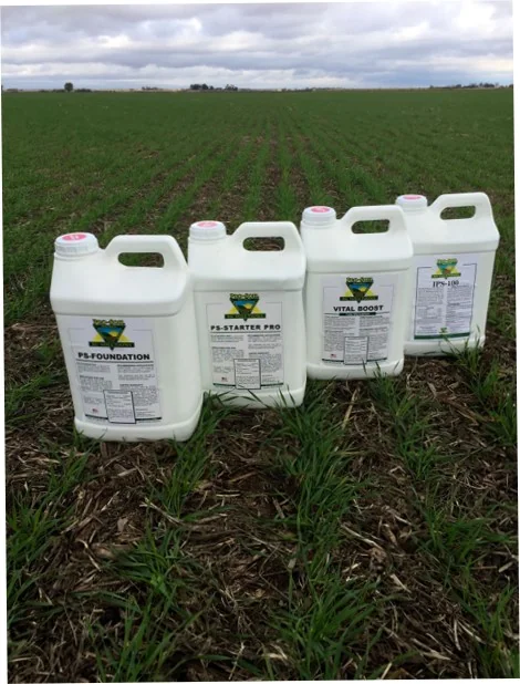 Pro-Soil PS-Foundation, PS-Starter Pro, Vital Boost and IPS-100 jugs in a field